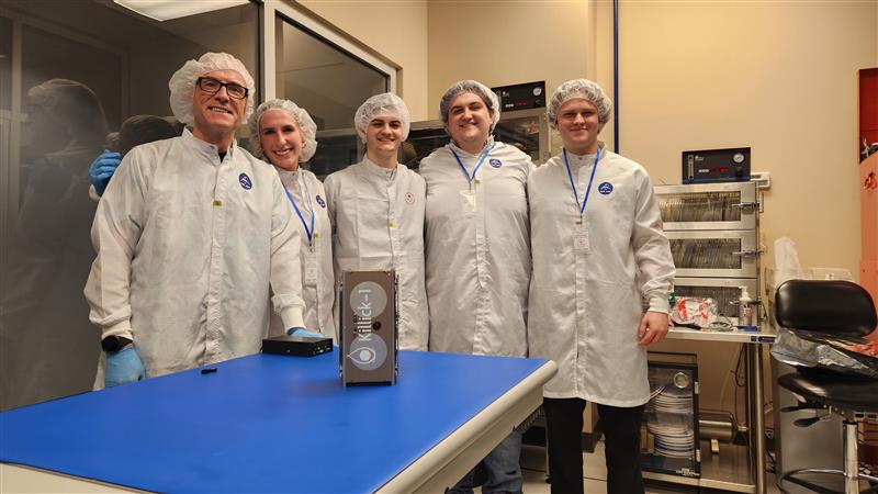 Killick-1 was Newfoundland and Labrador's first Earth Observation Satellite. The project was a joint initiative of C-CORE and Memorial University on the Canadian CubeSat Project, which was first initiated in 2018. Shown here are C-CORE's Des Power with four Memorial students Victoria Vaters, Cameron King, Matthew Fewer and Daniel Dolomount. The picture shows the Killick-1 satellite in a clean room at CSA headquarters just prior to integration of the satellite into the Nanoracks Launcher. Integration took place in November 2022, and Killick was launched from Kennedy Space Centre in 2023. It was placed into orbit from the International Space Station in May of 2023.