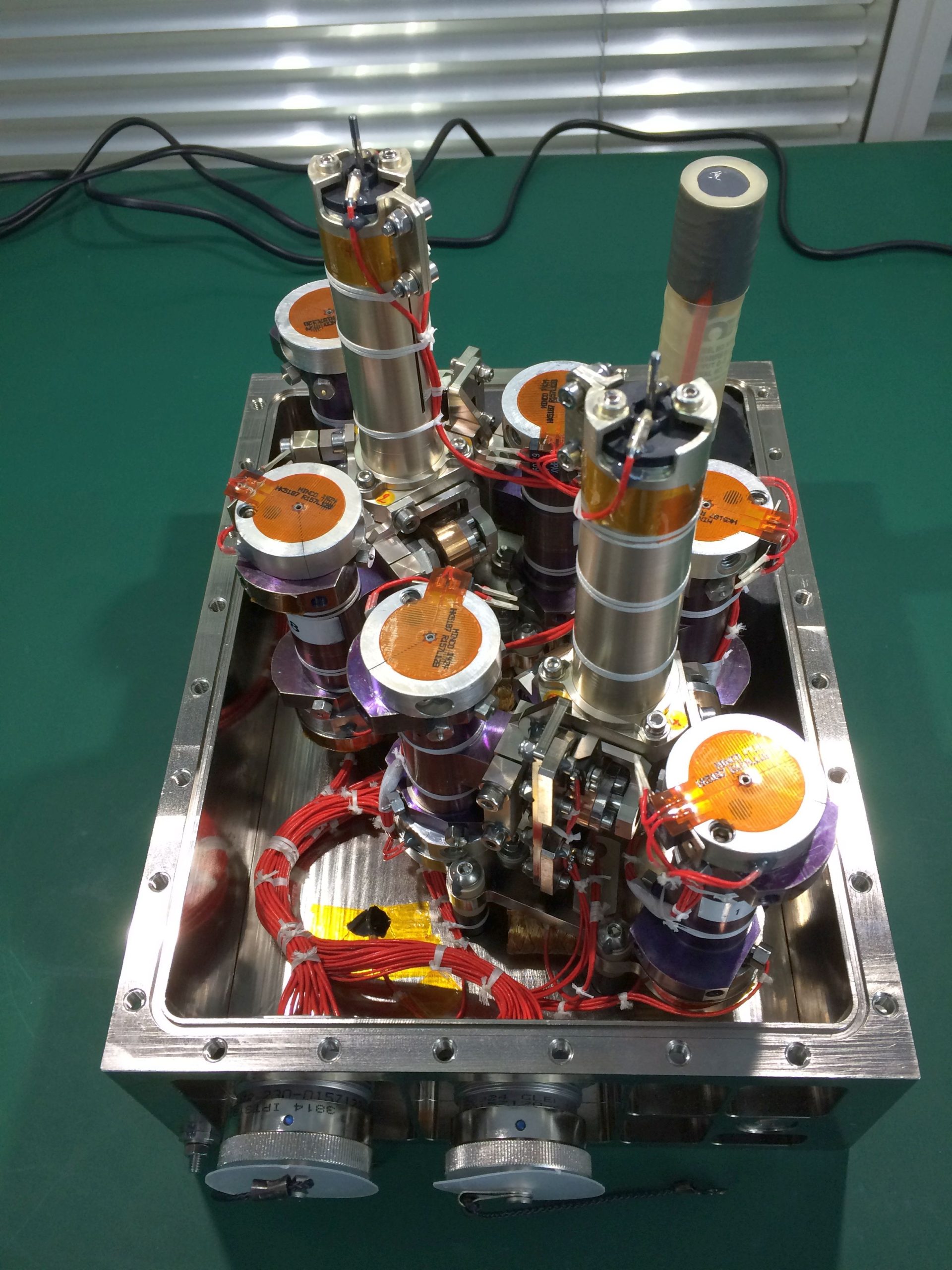 Soret Coefficients in Crude Oil (SCCO) payload with the different cells containing crude samples for testing in microgravity.